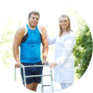 Pretty nurse and male patient looking at camera in park